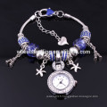 Nouvelle arrivée Lady glass beads eiffel towerl et star charms quartz montre-bracelet femme